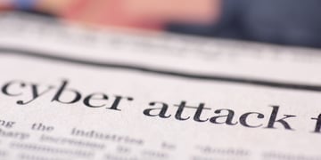 Cyber attack written on newspaper.