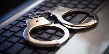 Selective focus on handcuffs on a keyboard