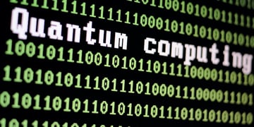Computer screen with quantum computing logo with a binary computer code background illustration