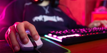 Professional guy typing on his keyboard and playing some game