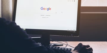 Man on a computer Browsing Google