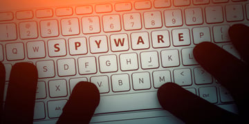 SPYWARE inscription on laptop keyboard