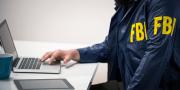 FBI agent working with a computer
