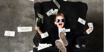 Rich kid throwing money