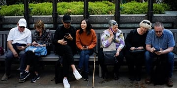 people looking at their phones