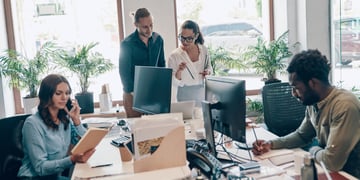 Group of young people working in an office