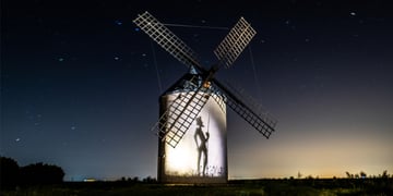 Don Quixote tilting at a windmill