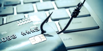 Credit cards on a fishing hook. Phishing attack concept
