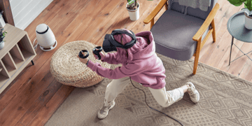 woman playing with VR glasses