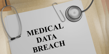 Medical data breach written on document with doctor's tools