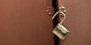 Open padlock and door