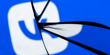 VK logo seen through shattered glass
