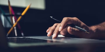 Hand using laptop mouse