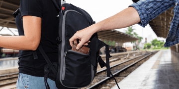 Tourist getting wallet pinched from her backpack