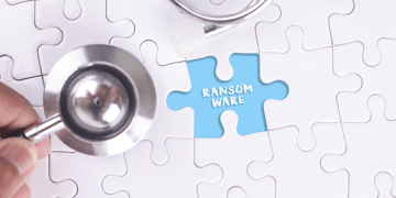 Physician's stethoscope above jigsaw puzzle saying ransomware