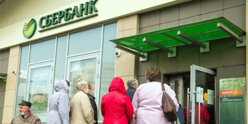 Sberbank logo, people waiting in line