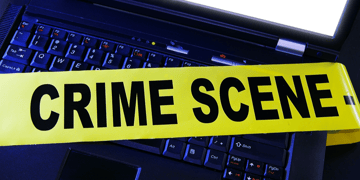 Crime scene sign on a computer