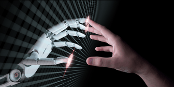 Robot hand touching a human hand