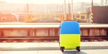 Suitcase of blue and yellow color oa railway