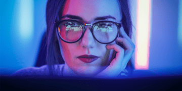 woman looking into a computer screen