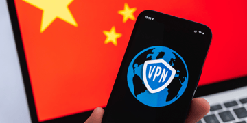 Concept photo of VPN protected mobile with Chinese flag on computer screen