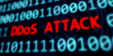 Screen with binary code and DDos written on it