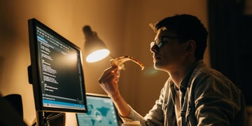 programmer with pizza