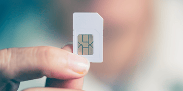 Ordinary SIM card held aloft