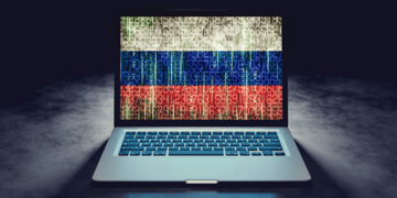 Russian flag on laptop screen in binary