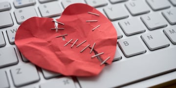 Romance scam heart and keyboard