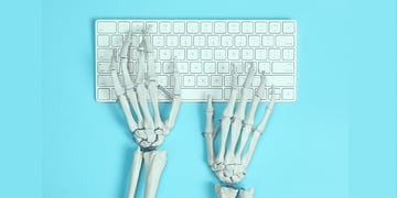hands of a skeleton typing