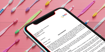 Toothbrushes in background with letter from JKD