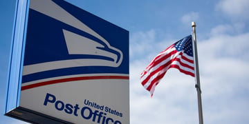 US Postal Service sign and US flag