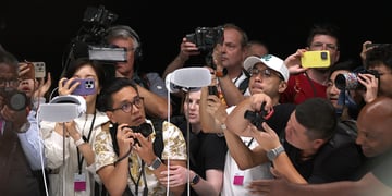Members of the media inspect the new Apple Vision Pro headset