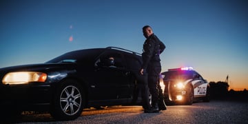 police officer pulls over car, police patrol