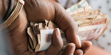 Woman holding Ethiopian birr