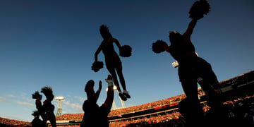 Cheerleading squad performs during a game.