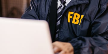 FBI Detective Using Laptop In His Office