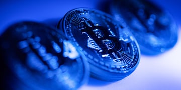 Bitcoin coins in blue background