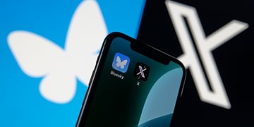 Blueskey and X logos separated by phone with Bluesky and X apps