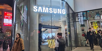 Pedestrians pass Samsung Electronics on Nanjing Road in Shanghai, China