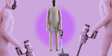House robot Neo by 1X Technologies golding a Dyson vacuum cleaner