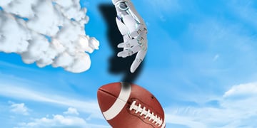 A robotic arm next to a football in the sky.