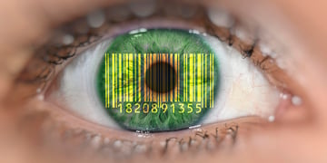 Detail of eye with barcode EANan Article Number, on iris, symbolic image