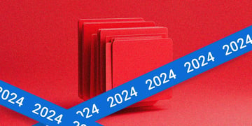 A pile of red files, with a blue tape reading 2024