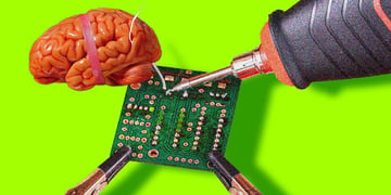 Tech soldering a brain.