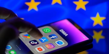 iPhone with major apps, EU flag in backround