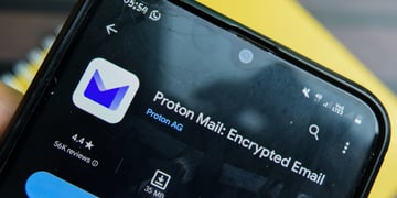 Proton logo seen through shattered smartphone glass