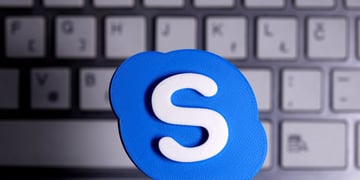 Skype logo against a keyboard in the background