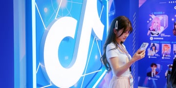 A Tiktok anime influencer next to Tiktok's logo.